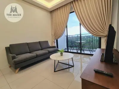 a living room with a couch and a table at The Cove Hillside Residence Ipoh - Elegance Parisian in Ipoh