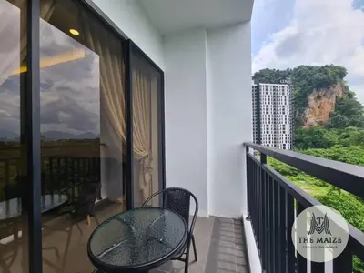 a balcony with a table and chairs and a view at The Cove Hillside Residence Ipoh - Elegance Parisian in Ipoh