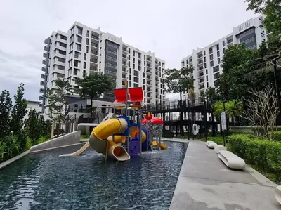 a water slide in the middle of a swimming pool at The Cove Hillside Residence Ipoh - Elegance Parisian in Ipoh