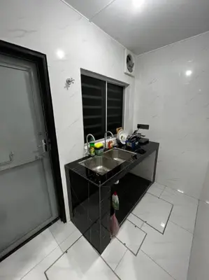 a kitchen with a sink and a counter top at raub homesty in Kampong Sempalit Hilir