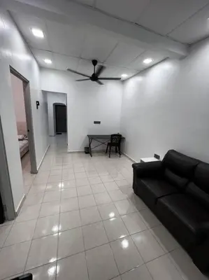 a living room with a couch and a ceiling fan at raub homesty in Kampong Sempalit Hilir