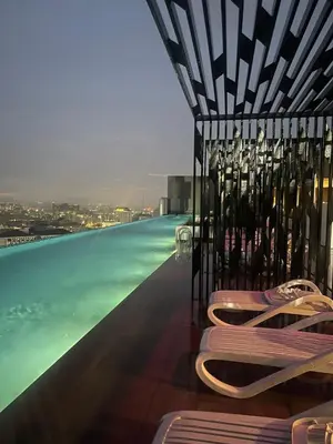 a pool with a bunch of bottles of wine at The Horizon Ipoh 3BR ORCHID - by Goswell in Ipoh