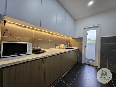 a kitchen with a microwave on top of a counter at The Cove Hillside Residence Ipoh - Tranquility Vibes in Ipoh
