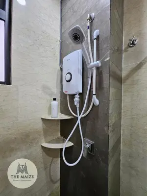 a shower in a bathroom with a hair dryer at The Cove Hillside Residence Ipoh - Tranquility Vibes in Ipoh