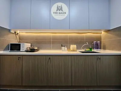 a kitchen with a microwave and a counter top at The Cove Hillside Residence Ipoh - Tranquility Vibes in Ipoh