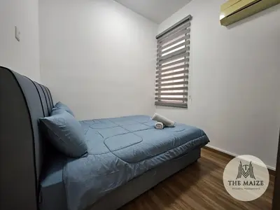 a small bedroom with a bed and a window at The Cove Ipoh - Blissful Abodes in Tambun