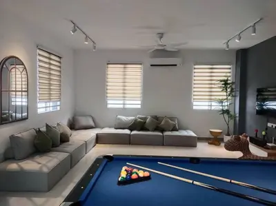 a living room with a pool table in the middle at Tints of Green Pool Bungalow-6 Bedroom-Karaoke-BBQ in Sultan Azlan Shah Airport