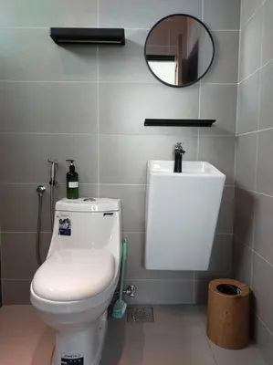 a bathroom with a white toilet and a mirror at Tints of Green Pool Bungalow-6 Bedroom-Karaoke-BBQ in Sultan Azlan Shah Airport