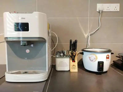 a coffee maker sitting on top of a counter at Tints of Green Pool Bungalow-6 Bedroom-Karaoke-BBQ in Sultan Azlan Shah Airport