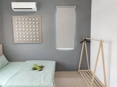 a bedroom with a teddy bear laying on a bed at Tints of Green Pool Bungalow-6 Bedroom-Karaoke-BBQ in Sultan Azlan Shah Airport