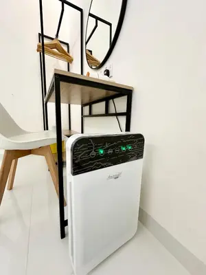 a dishwasher next to a table and a chair at Stylish Cozy Landed Jelutong 3BR 2B 4CP-10pax by 3C in Jelutong