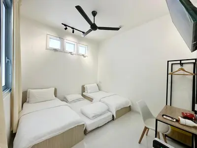 a bedroom with two beds and a ceiling fan at Stylish Cozy Landed Jelutong 3BR 2B 4CP-10pax by 3C in Jelutong