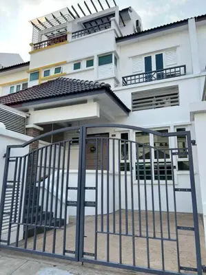 a white building with a gate in front of it at Karpal Singh Drive Seaside Georgetown 4BR-15pax by 3C in George Town