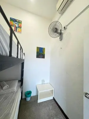 a bedroom with a bunk bed and a bunk bed at Moustachz Hauze , Georgetown in George Town