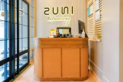 a shop with a counter in a room with windows at Robin Hotel in Ipoh