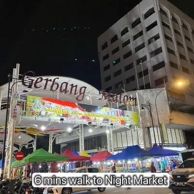 a night scene of a market in a city at Ipoh Town Majestic Suites by IWH Suites in Ipoh
