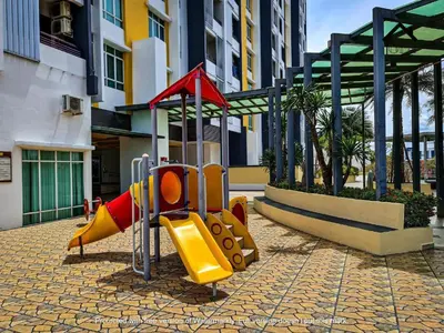 a playground in front of a building at Ipoh Town Majestic Suites by IWH Suites in Ipoh