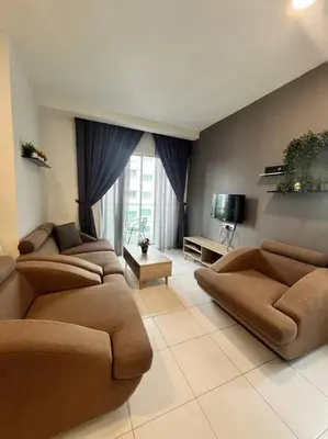 a large living room with couches and a tv at LIly Brava 7 in Tanah Rata