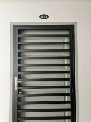 a metal garage door in a room at LIly Brava 7 in Tanah Rata