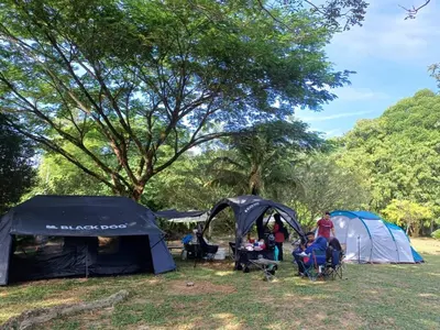 a group of people camping in a field with tents at Lemuni Retreat & Training Centre - Kerling, Selangor in Kerling