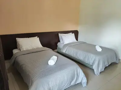two beds sitting next to each other in a room at Lemuni Retreat & Training Centre - Kerling, Selangor in Kerling