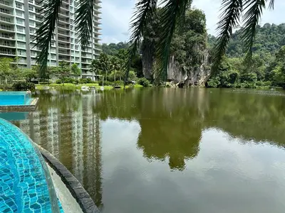 a large body of water in front of a building at Ipoh lakeside Suite Ipoh 4pax in Ipoh