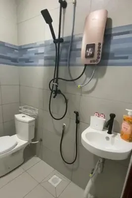 a shower in a bathroom with a toilet and a sink at Renovate on progress in Kuala Kubu Baharu