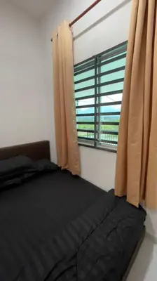 a bedroom with a black bed and a window at Rumah Kita HStay BM view Self check in 2Room in Kubang Semang