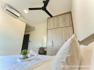 a bedroom with a white bed with a wooden door at Kampung Paloh Residence Ipoh with 2 Parking & Free Netflix in Ipoh
