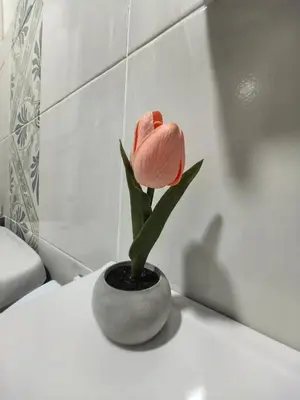 a pink flower in a vase on top of a toilet at Ipoh Anderson Suite 1802 By Hopestay in Ipoh