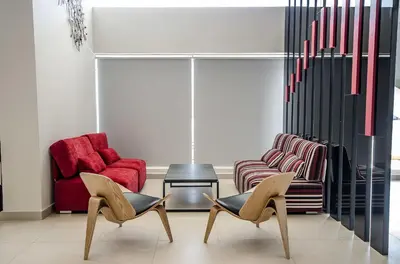 a living room with two chairs and a table at Neo+ Penang in George Town