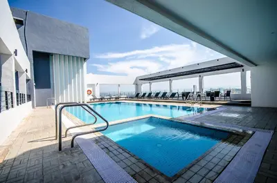 a swimming pool on the top of a building at Neo+ Penang in George Town