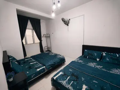 a bedroom with two beds and a window at Ammara Homestay 2 Emerald Avenue Brinchang in Brinchang