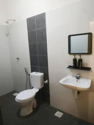 a bathroom with a toilet and a sink at Setia Homestay Chemor Setia in Chemor