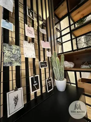 a room with a cactus and signs on a wall at The Urban Lodge - Tasek Avenue Ipoh in Ipoh
