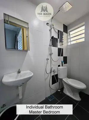 a bathroom with a sink and a toilet and a mirror at Cozy Nest - Sky Garden Residence Ipoh in Chemor