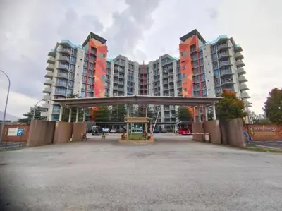 an empty parking lot in front of tall buildings at Cozy Nest - Sky Garden Residence Ipoh in Chemor