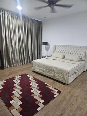 a bedroom with a bed and a rug on the floor at Mysa at Meru Ipoh in Ipoh