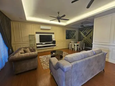 a living room with two couches and a television at Mysa at Meru Ipoh in Ipoh