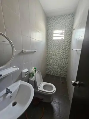 a bathroom with a white toilet and a sink at Mysa at Meru Ipoh in Ipoh