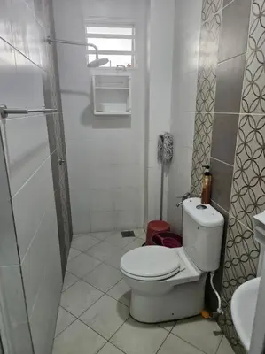 a white bathroom with a toilet and a shower at Mysa at Meru Ipoh in Ipoh