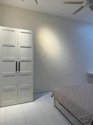 a bedroom with a bed and a ceiling fan at Super Minimalist SP Town Centre in Sungai Petani