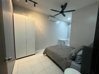 a bedroom with a bed and a ceiling fan at Super Minimalist SP Town Centre in Sungai Petani