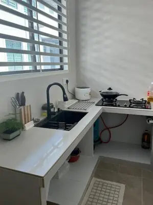 a kitchen with a sink and a stove with a window at Super Minimalist SP Town Centre in Sungai Petani