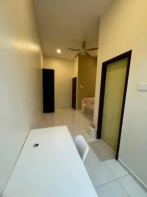 a room with a white table and a bed at Super Minimalist SP Town Centre in Sungai Petani