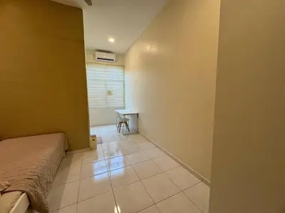 a bedroom with a bed and a table in a room at Super Minimalist SP Town Centre in Sungai Petani