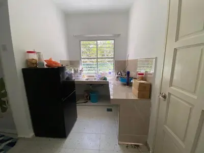 a kitchen with a counter top in a room at Rumah Bukit Jalan Kolam Air in Kuala Kubu Baharu