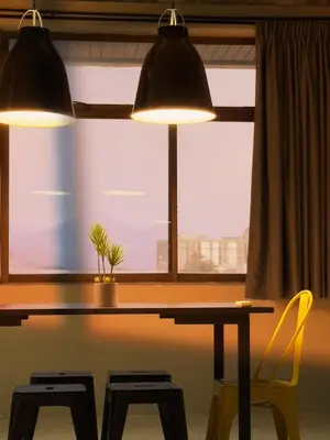 two lights above a table with a plant in a window at M2 Living Townhouse in Ipoh in Ipoh