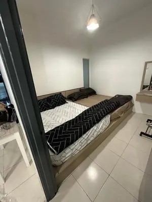 a bed is inside of a room at AYAAN HOMESTAY HiLL ViEW IIN FREE WIFI & NETFLIX in Tanah Rata