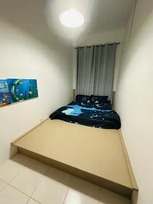 a small room with a bed in the corner at AYAAN HOMESTAY HiLL ViEW IIN FREE WIFI & NETFLIX in Tanah Rata